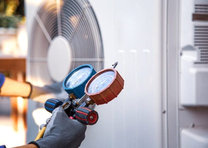 Heat and Air Conditioning, HVAC system service technician using